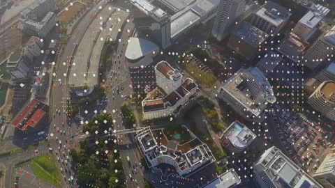 Digital Network Animation Over Cityscape Showcasing Financial Data