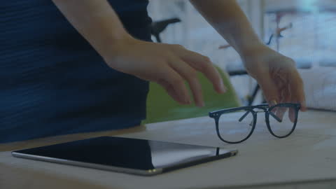 Close-up of Business Professional Reaching for Glasses