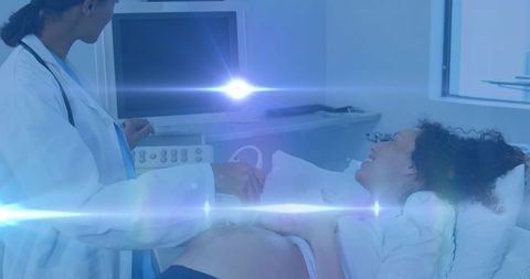 Doctor Performing Ultrasound for Radiant Pregnant Woman