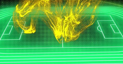 Abstract yellow flames over digital soccer field