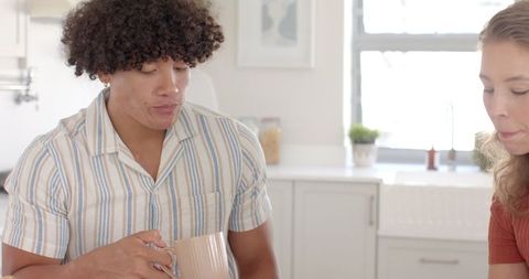 Diverse Friends Enjoying Coffee at Home Kitchen Counter