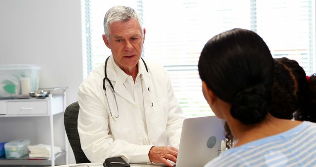 Doctor and patient interacting with each other in clinic