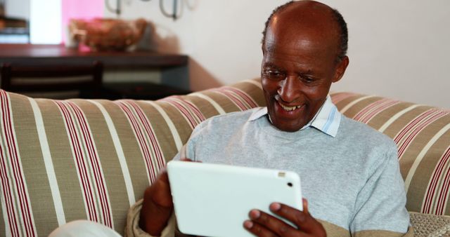 Senior Man Using Digital Tablet on Sofa - Download Free Stock Images Pikwizard.com