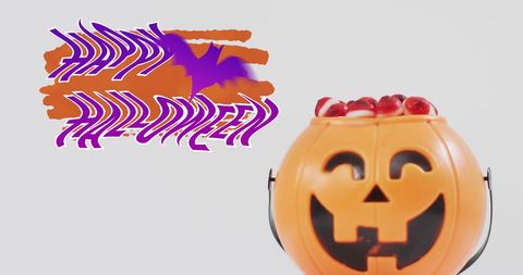 Happy Halloween Text with Pumpkin Bucket and Sweets - Download Free Stock Images Pikwizard.com