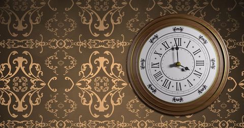 retro clock striking midnight on elegant floral wallpaper - Download Free Stock Images Pikwizard.com