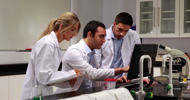 Scientists Working Collaboratively in Modern Laboratory Setting - Download Free Stock Images Pikwizard.com