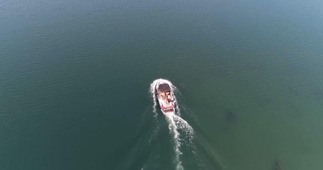 Aerial View of a Boat Cruising on Calm Lake Waters - Download Free Stock Images Pikwizard.com