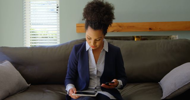 Businesswoman Multitasking with Tablet and Smartphone on Couch - Download Free Stock Images Pikwizard.com