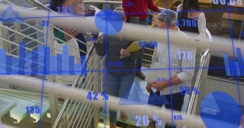 Diverse Business People Analyzing Data in Innovative Work Environment