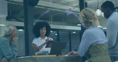 Diverse Professionals in Modern Tech Office Collaborating