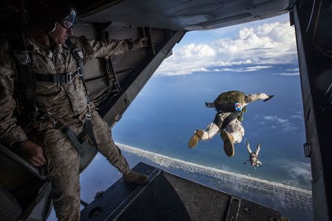 Military Paratroopers Jump from Plane Over Ocean - Download Free Stock Images Pikwizard.com
