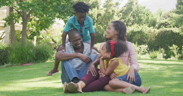 Happy Family Enjoying Outdoor Time Together on Green Lawn - Download Free Stock Images Pikwizard.com