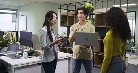 Diverse Team Collaboration in Open Plan Office Workspace