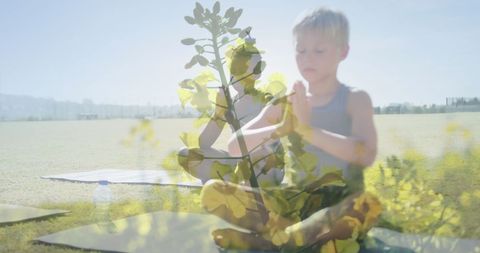Schoolboys practicing outdoor yoga with double exposure effect