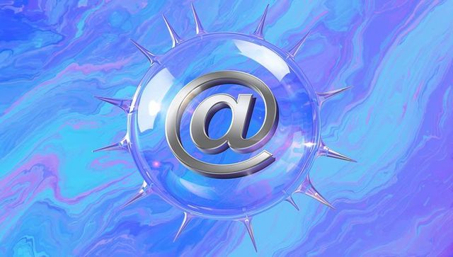 Glowing glass orb containing metallic at sign floating over marbled blue iridescent swirl