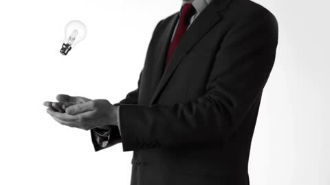 Businessman Tossing Light Bulb in Slow Motion