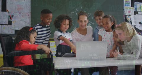 Diverse Elementary Classroom with Laptops and Teachers
