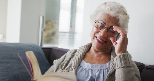 Elderly Woman Reading Book While Relaxing on Sofa - Download Free Stock Images Pikwizard.com