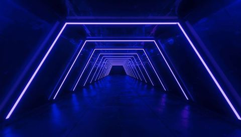 Futuristic neon tunnel featuring geometric led frames and deep blue cyberpunk perspective