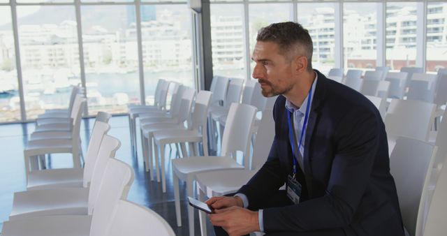 Businessman Preparing for Corporate Presentation in Empty Conference Room - Download Free Stock Images Pikwizard.com