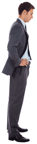 Serious Businessman in Grey Suit with Hands on Hips Transparent Background