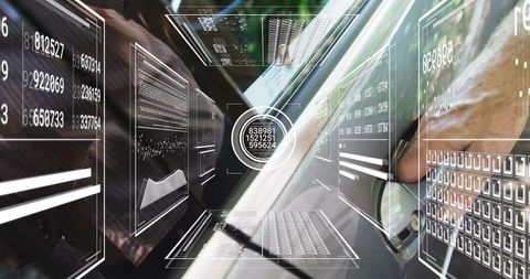 Mature analyst using laptop in cockpit with holographic hud dashboards and steering control