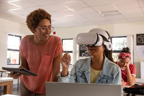 Teacher Guiding Student in Virtual Reality Experience