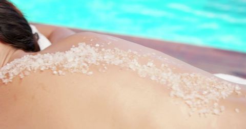 Relaxing salt scrub treatment by poolside