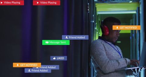 Engineer Managing Data Center Alerts on Laptop with Notifications