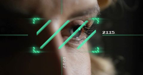 Scanning woman's eye with neon hud reticle and digital iris recognition