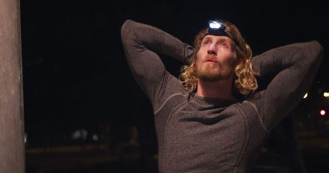 Evening exercise in city park with headlight