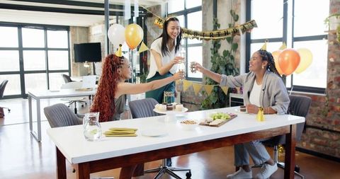 Colleagues Celebrating Birthday Party in Office Setting