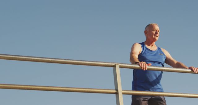 Senior Man Enjoying Sunny Day while Standing on Bridge - Download Free Stock Images Pikwizard.com