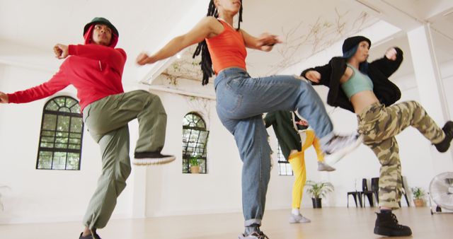 Happy group of diverse male and female dancers dancing in dance studio - Download Free Stock Photos Pikwizard.com