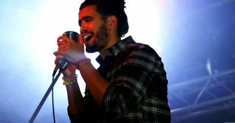 Young Caucasian Musician Singing Passionately on Stage - Download Free Stock Images Pikwizard.com
