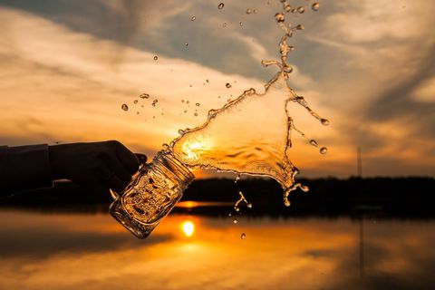 Splashing Water Frozen in Mid-Air at Sunset Flawless Moment