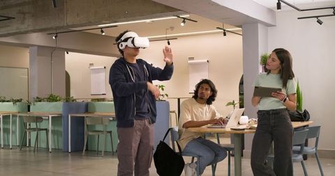 African american team demonstrating vr collaboration in modern coworkorking space