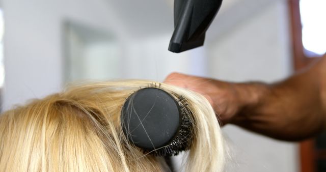 Hairdresser Styling Blonde Hair with Round Brush and Hairdryer - Download Free Stock Images Pikwizard.com