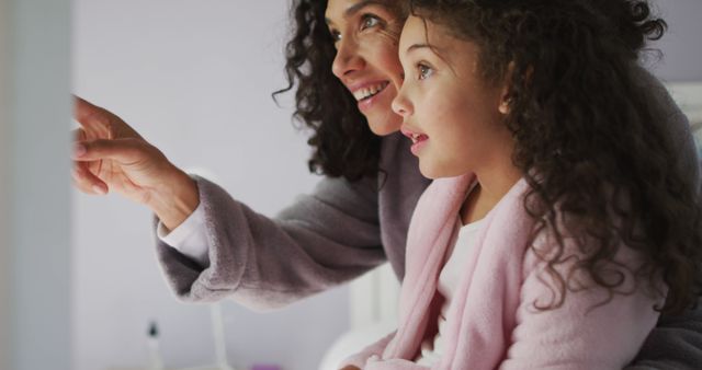 Mother and Daughter Looking Out Window with Excitement - Download Free Stock Images Pikwizard.com