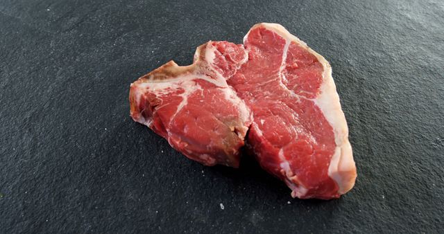 Raw T-Bone Steak on Black Slate Background - Download Free Stock Images Pikwizard.com