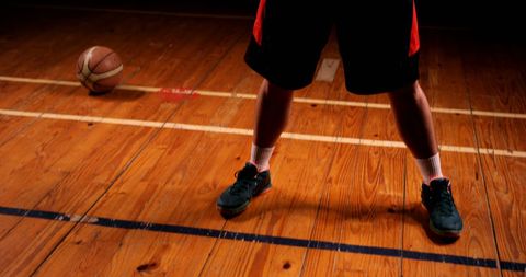 Focused Basketball Player Stance on Indoor Court