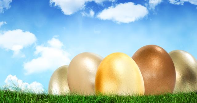 Colorful Easter Eggs on Green Grass Against Blue Sky with Clouds - Download Free Stock Photos Pikwizard.com