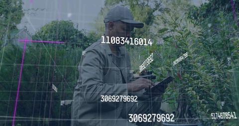 Nursery Worker Scanning Plants with Tablet and Augmented Reality IDs for Smart Horticulture
