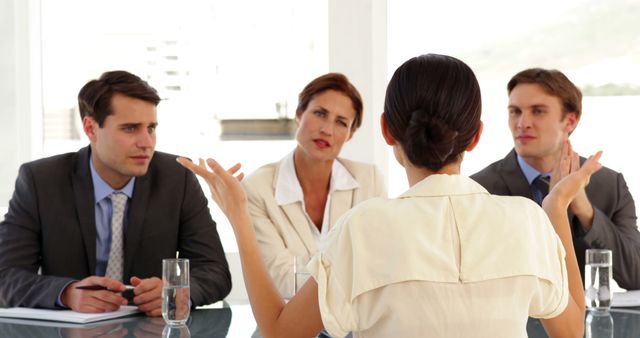 Businesswoman Addressing Colleagues in Conference Room Meeting - Download Free Stock Images Pikwizard.com