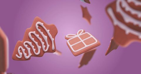Festive Gingerbread Cookies in Falling Motion on Purple Background