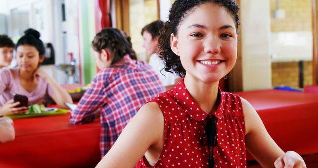 Smiling Teenage Girl in School Canteen with Friends - Download Free Stock Images Pikwizard.com