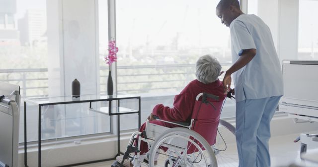 Caring Nurse Assisting Elderly Patient in Wheelchair at Modern Healthcare Facility - Download Free Stock Images Pikwizard.com