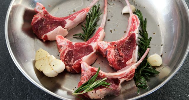 Raw Lamb Chops with Rosemary and Garlic in Stainless Steel Pan - Download Free Stock Images Pikwizard.com