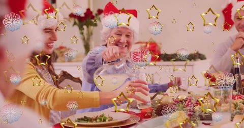Smiling Senior Pouring Christmas Drink to Granddaughter