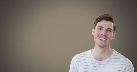 Young Man Smiling Confidently in Casual Striped Shirt - Download Free Stock Images Pikwizard.com